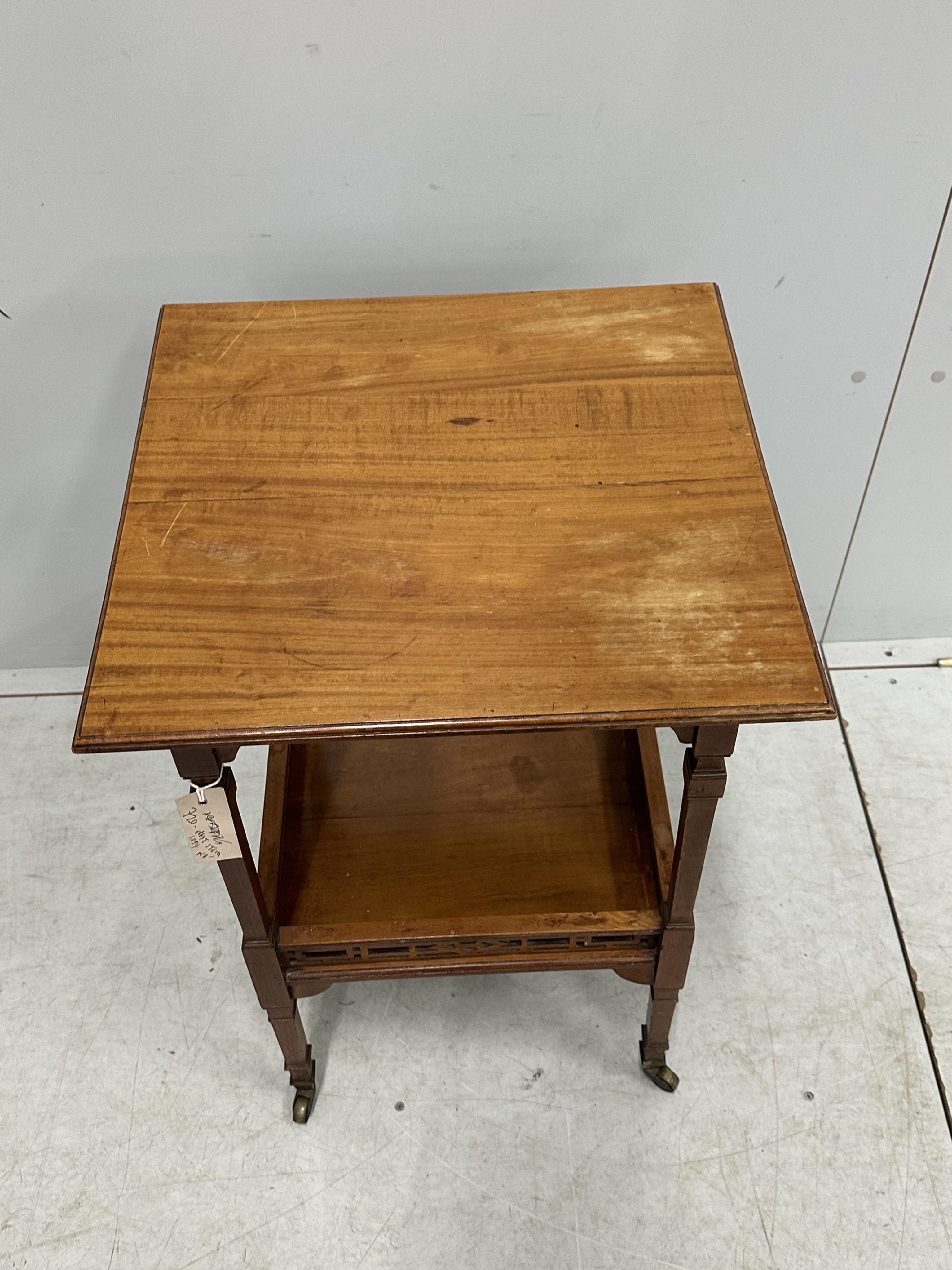 A late Victorian Aesthetic Movement satinwood two tier occasional table, width 48cm, depth 47cm, height 73cm. Condition - fair